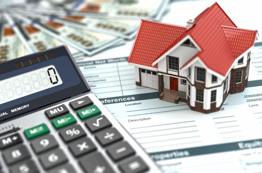 Here's an alt tag for the image: House model, calculator, and mortgage paperwork.