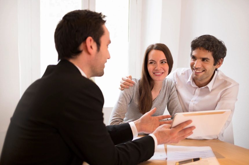 Couple consulting with financial advisor.